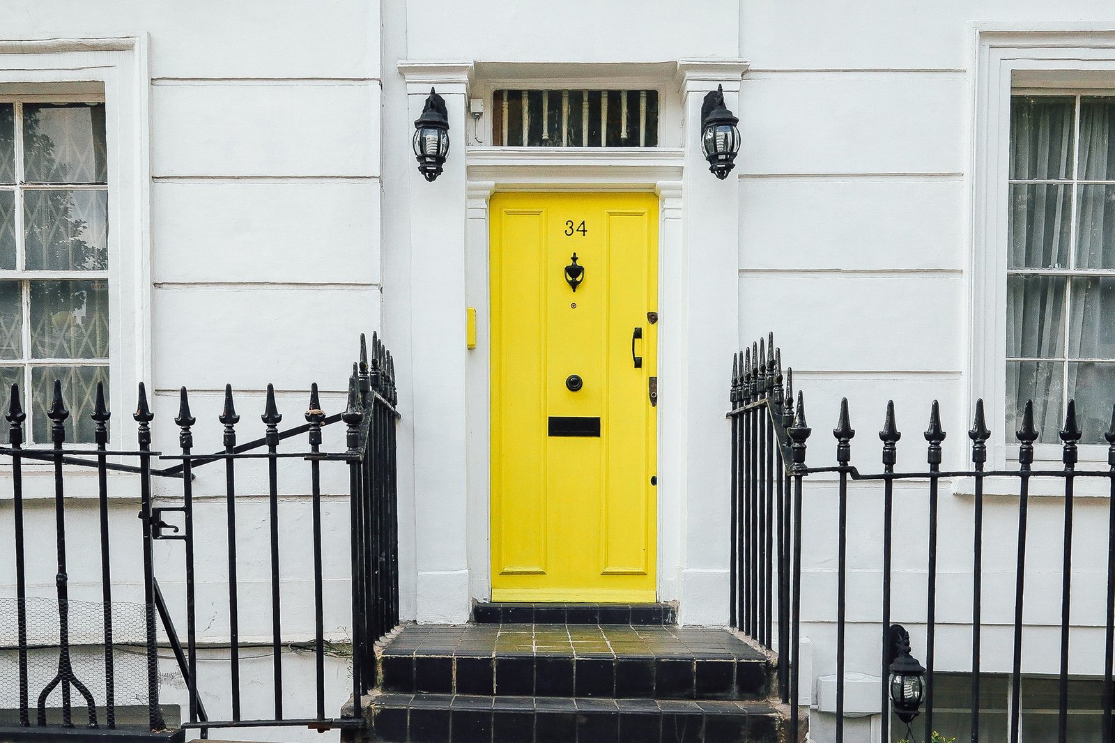 Yellow door to georgian house. UK